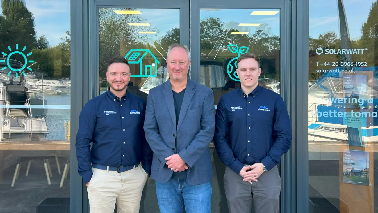 Photograph in front of the SOLARWATT UK office doors. From left to right: Neil McKee (, BHC Distributors), Neal Goddard (Managing Director, SOLARWATT UK & Ireland), Stephen Kane (Head of Operations, BHC Distributors)