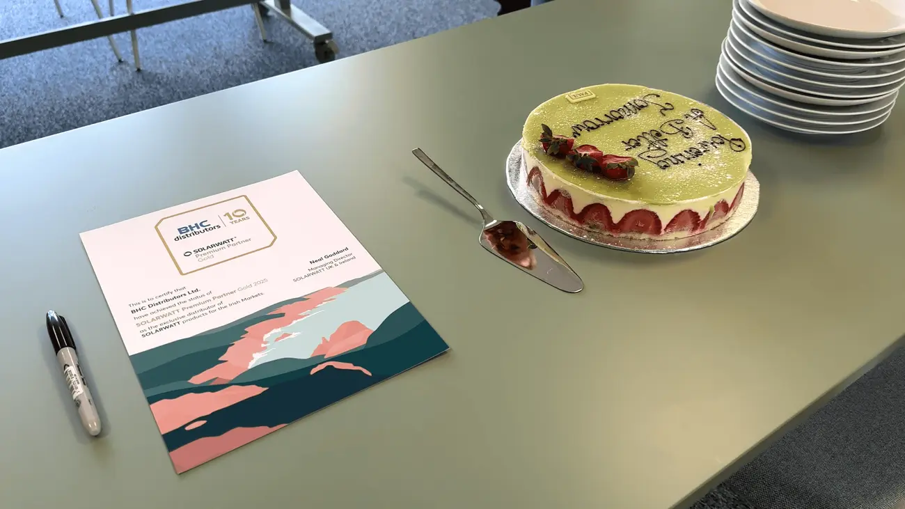 The team from BHC Distributors and SOLARWATT celebrate the signing of the agreement with tea and cake.